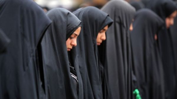 Iraqi Shiite Muslim women pray at the shrine of Imam Al Kadhim in the northern district of Kadhimiya, where the bomb exploded on Saturday. The bomb may have specifically targeted Shiites in the area. AFP Image