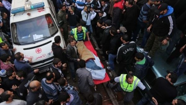 Medics take care of one of the 34 individuals wounded in Tuesday's bomb attack. An additional four people were killed (STR/AFP)