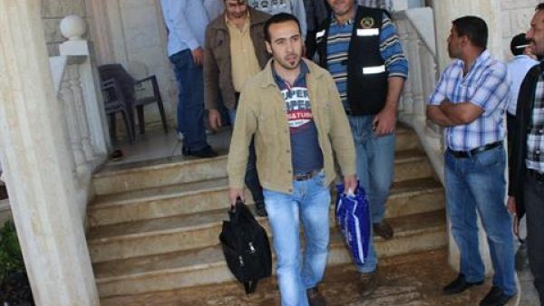 Army Intelligence personnel escort freed Syrians out of al-Ahmad family's residence in the village of Hisheh, north Lebanon, on Saturday, April 27, 2013. (The Daily Star/Antoine Amrieh)