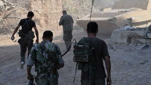 Syrian army soliders walk in the Damascus suburb of Jobar in August. Jordan said on Sunday that it is currently housing over 2,000 Syrian army defectors. (AFP)