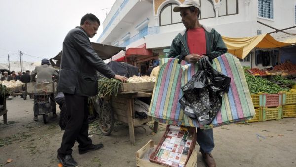 A vendor sells his wares in the Tunisian capital Tunis (Photo AFP/Fethi Belaid)