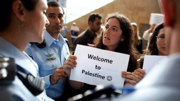 Left wing Israeli activists are arrested by Israeli police as they demonstrate in favor of the 'Welcome to Palestine' fly-in protest.