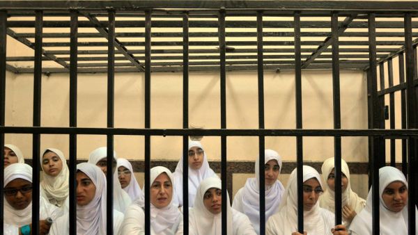 Fourteen women and seven girls were sentenced to heavy jail terms due to their alleged ties to the Muslim Brotherhood and participation in a violent October protest (AP)


