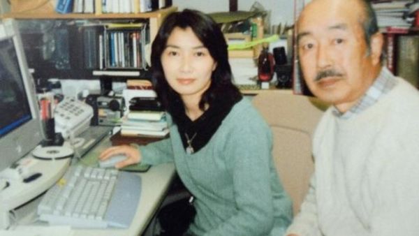 Yamamoto pictured with her Father in 1998. He said of his late daughter, he respects her as a journalist who "always stood against those with power" [source: AFP]