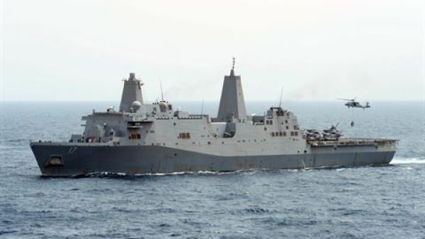 US Navy handout image shows an MH-60S Sea Hawk helicopter hauling cargo from the amphibious transport dock ship USS San Antonio (LPD 17) during a replenishment-at-sea in the Gulf of Aden. (AFP)