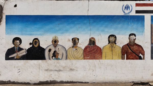 A damaged wall in a refugee camp in Yemen