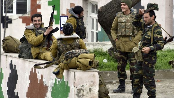 Soldiers of the defense army of Nagorno Karabakh gather in the village of Mataghis, some 70km north of Karabakh's capital Stepanakert, on April 6, 2016. (AFP/Karen Minasyan)