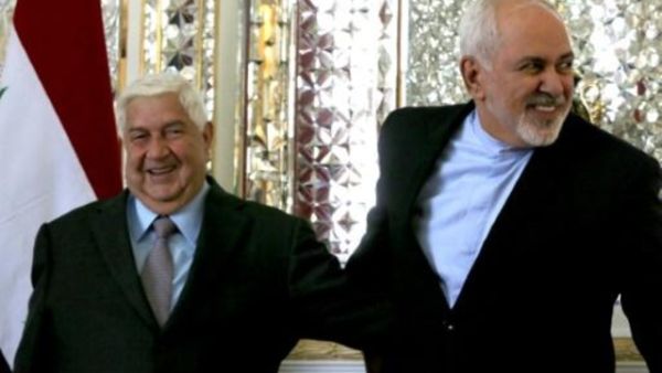 وزير الخارجية الإيراني محمد جواد ظريف (يمين) ونظيره السوري وليد المعلم