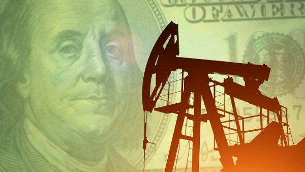 The U.S. dollar inched higher versus a basket of major currencies on Tuesday. Oil markets were split. (Shutterstock)