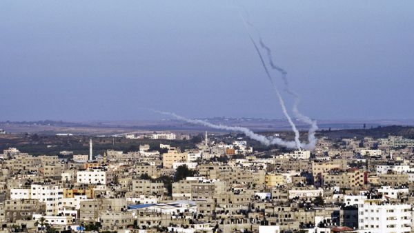 Palestinians fire rockets at Israel from Gaza during last summer's conflict. (AFP/File)