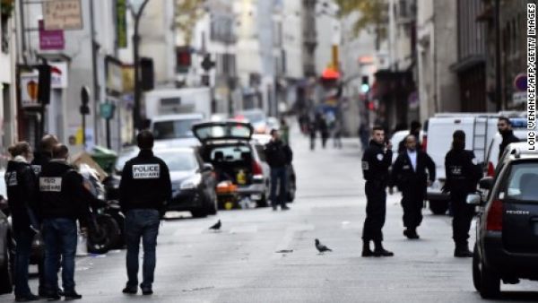 Police stand near Cafe La Belle Equipe, one of the sites of the Paris attacks. (AFP/Loic Venance)