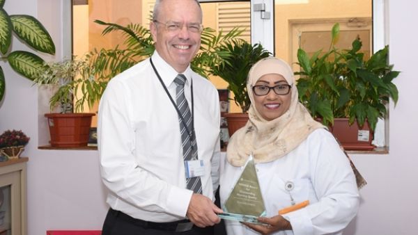 Ms. Ghaya Al Tamimi and Dr. Steven Beaumont, Rumailah Hospital, HMC, with their NDNQI award Ms. Ghaya Al Tamimi and Dr. Steven Beaumont, Rumailah Hospital, HMC, with their NDNQI award