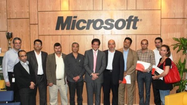 Microsoft Jordan team members group around Husni Khuffash
