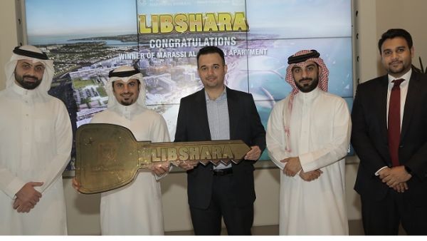 The winner with Mr. Subah Al Zayani and representatives from KFH-Bahrain and Marassi Al Bahrain
