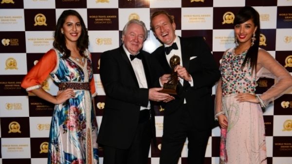 Alexander Schneider (right) pictured with awards hostesses and Graham Cooke – President and Founder of World Group (left) Alexander Schneider (right) pictured with awards hostesses and Graham Cooke – President and Founder of World Group (left)