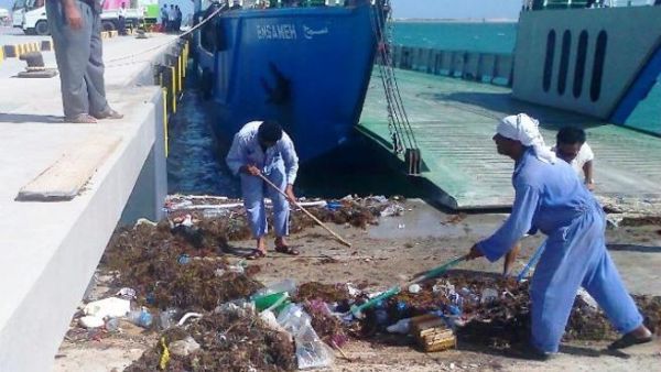 ADPC workers in action cleaning the Mugharrag Port in the Western Region