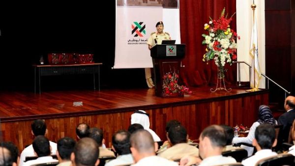 ADU students listening to a speech given during their visit