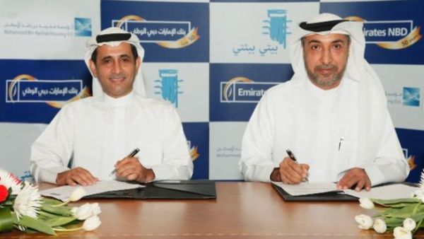 Al Marzouqi with Al Marri at the signing ceremony
