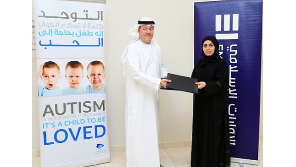 Awatif Al Harmoodi, General Manager, Operational Quality & Processes at Emirates Islamic, presenting the cheque to Mr. Mohammad Amin Al-Emadi, Board Member at Dubai Autism Center. Awatif Al Harmoodi, General Manager, Operational Quality & Processes at Emirates Islamic, presenting the cheque to Mr. Mohammad Amin Al-Emadi, Board Member at Dubai Autism Center.