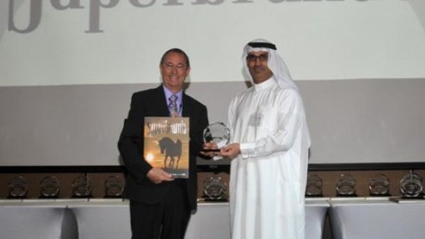 Khalid Hadi, Director of Brand & Corporate Communications, receiving the Superbrands Award for ENOC from Mike English, Director, Superbrands Middle East Khalid Hadi, Director of Brand & Corporate Communications, receiving the Superbrands Award for ENOC from Mike English, Director, Superbrands Middle East