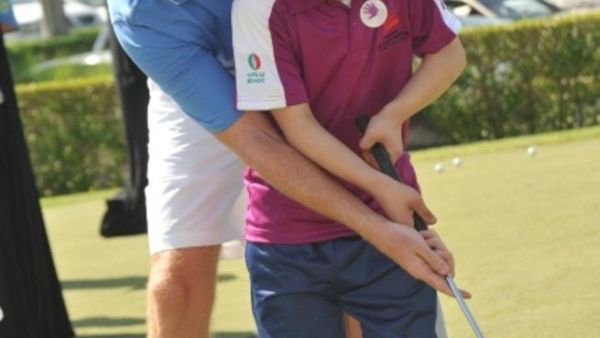 An ENOC employee at the UAE Down Syndrome Charity Golf Day and Auction An ENOC employee at the UAE Down Syndrome Charity Golf Day and Auction