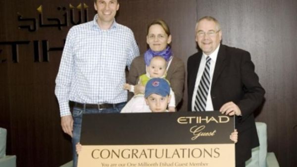 Etihad Guest one-millionth member with his family, and Dr Barry Green, Etihad’s Vice President Customer Relationship Management and Loyalty
