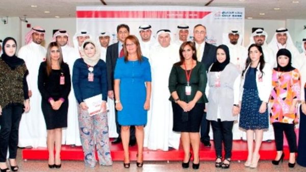 Surour Alsamerai, General Manager, Human Resources and Aly Shalaby, General Manager, Consumer Banking Group at Gulf Bank along with employees after receiving their certificates Surour Alsamerai, General Manager, Human Resources and Aly Shalaby, General Manager, Consumer Banking Group at Gulf Bank along with employees after receiving their certificates