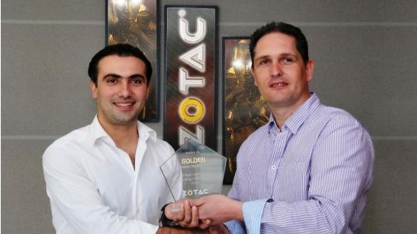 Vice President, EMEAI of ZOTAC presenting the award to the Chief Operating Officer of Golden Systems ME Vice President, EMEAI of ZOTAC presenting the award to the Chief Operating Officer of Golden Systems ME