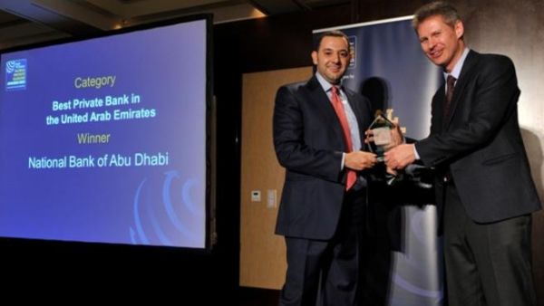 Hani AlNabulsi, Head of Business Development & Marketing in Private Banking at NBAD receives “Best Private Bank in UAE for 2013” award from Yuri Bender, Editor of Professional Wealth Management Magazine