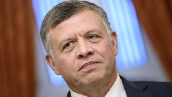 King Abdullah II underlined the need for all state institutions to rationalize spending and balance taxes against the quality of services provided to citizens. (AFP)