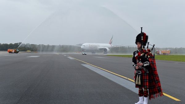 Emirates is welcomed to Edinburgh Airport with a water cannon salute and a bagpiper. 