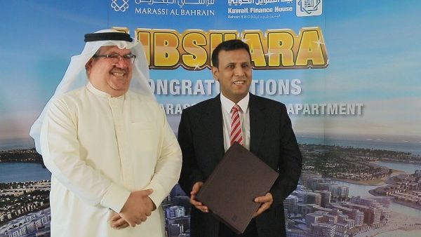 Mr. Khalid Rafea with the winner Mr. Adel Sarea