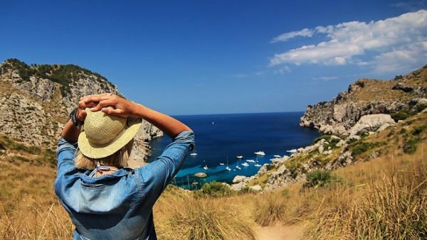 Summer vacations could trigger a less cautious approach to spending. (Pexels)