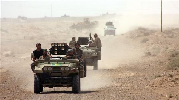 Iraqi forces drive through the Anbar province ahead of an operation to recapture the city of Ramadi. (AFP/Ahmed al-Rubaye)