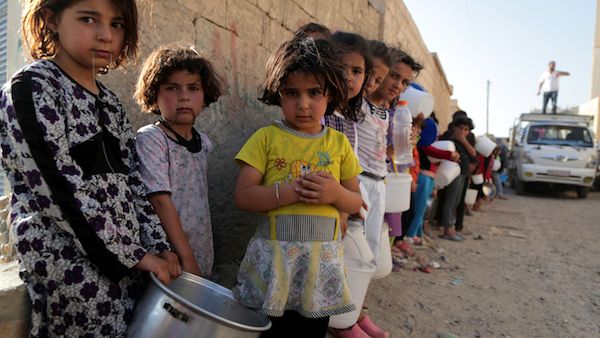 School-aged children receive a modicum of education in disused buildings. (File/Photo)