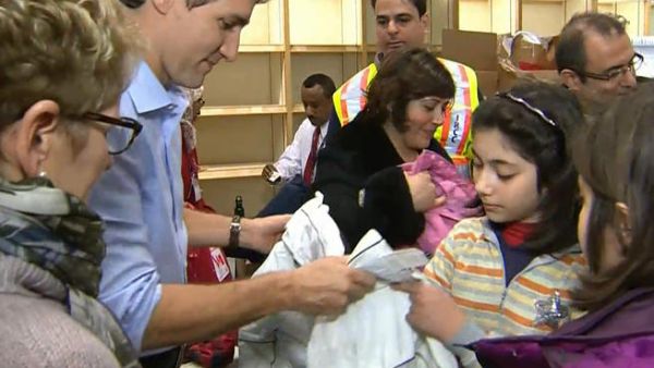 Canadian Prime Minister Justin Trudeau greets Syrian refugees in Toronto. (Twitter)