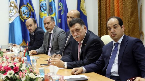 Libya's UN-backed Prime Minister-designate, Fayez al-Sarraj meets with members of the presidential council on March 31, 2016 in the capital Tripoli. (AFP/Mahmud Turkia)