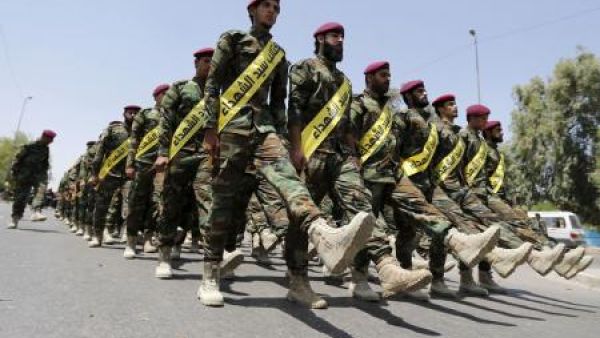 مقاتلون من قوات الحشد الشعبي الشيعية العراقية قي استعراض عسكري قي بغداد
