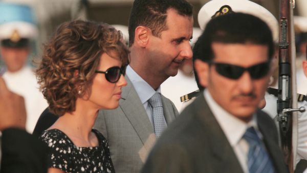 Bashar al-Assad (C), president of Syria, and his wife Asma al-Assad (L) (Shutterstock)
