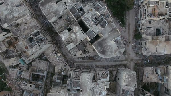 Many believe the military has intentionally targeted civilian buildings to help implement a controversial urban planning scheme called “Homs Dream” (Shutterstock/File)