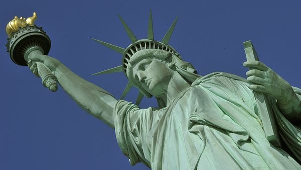 Despite the US' iconic Statue of Liberty, which is meant to welcome the world's "huddled masses yearning to breathe free," the US only accepted 400 Syrian refugees last year, while countries like Germany have taken in hundreds of thousands.  (AFP/File)