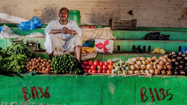 A man sells vegetables in Khartoum, Sudan on April 18, 2016.  (Photo courtesy Ahmad Aladdin at portraitat.tumblr.com)