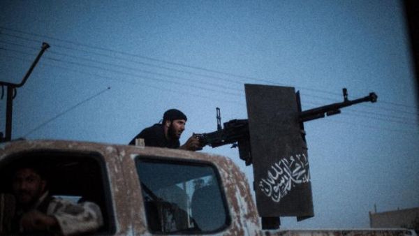 Ahrar al-Sham was founded in late 2011 and became a force on the Syrian battlefield in 2012. Here a member is seen firing during clashes in the Raqqa province. (AFP/Alice Martins)