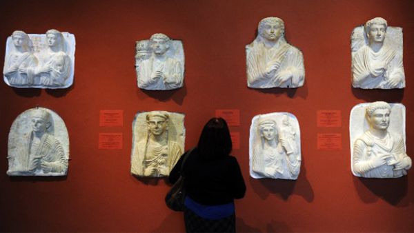 A woman looking at exhibits in the Palmyra Hall at the State Hermitage Museum in St. Petersburg. (AFP/File)