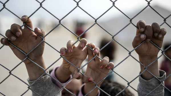 Syrian children await aid at a refugee camp in Turkey on February 2, 2015.  (AFP/Bulent Kilic)