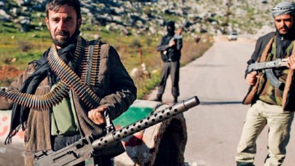 Syrian rebels man a checkpoint in northern Syria's Idlib region. (AFP/File)
