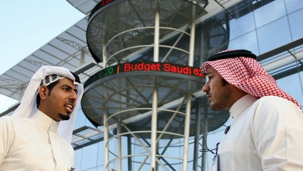 Saudi men chat outside the Saudi Stock Exchange in Riyadh. (AFP/ File) Saudi men chat outside the Saudi Stock Exchange in Riyadh. (AFP/ File)