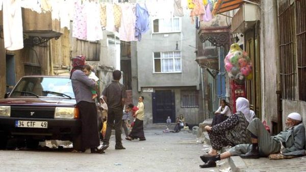 Clean laundry dries on lines stretched from house to house above residents of Istanbul's Tarlabasi neighborhood.  (AFP/Mustafa Ozer)