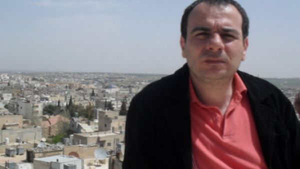 الصحفي الأردني تيسير النجار 