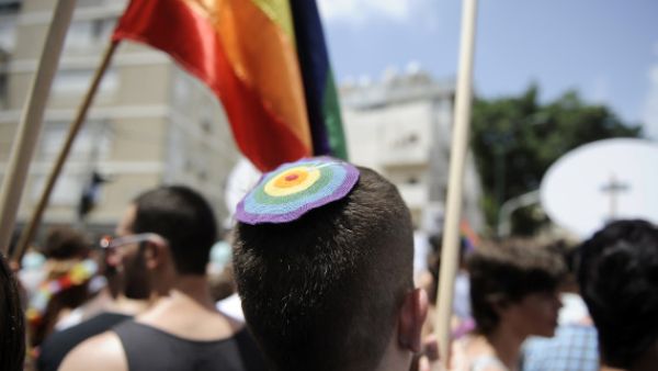 A man wears a rainbow kippah at Tel Aviv's 2013 gay pride parade.  (AFP/David Buimovitch)